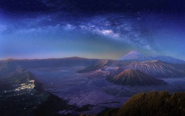 Landscape with Milky way galaxy over Mount Bromo volcano (Gunung Bromo) in Bromo Tengger Semeru National Park, East Java, Indonesia. Night sky with stars. Long exposure photograph. clipart