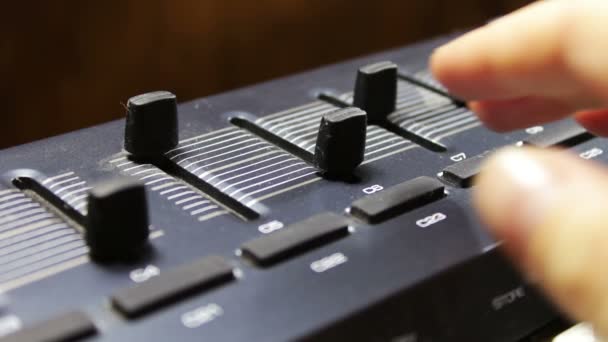 Female hand tunes midi synthesizer keyboard — Stock Video