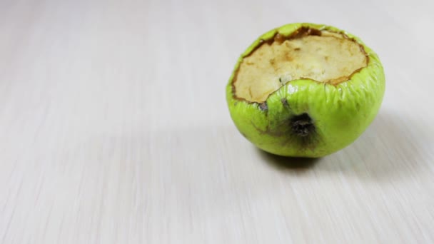 Ugly rotten apple on a white background — Stock Video