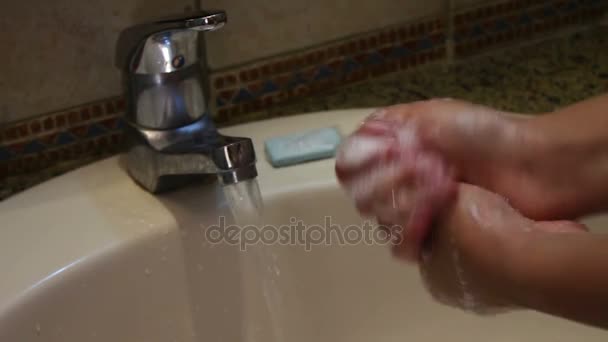 Woman washes her hands with soap over the sink — Stock Video