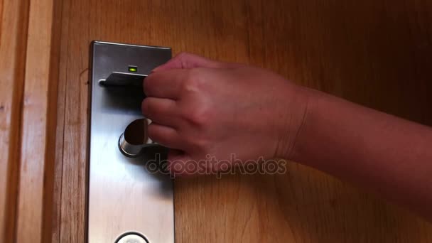 Woman opens the door with the key card — Stock Video