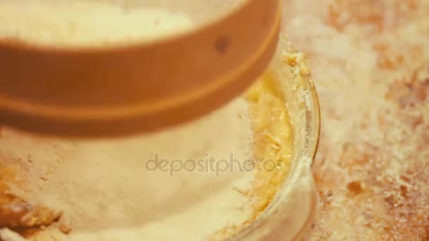 Female hand sifted flour through a sieve — Stock Video