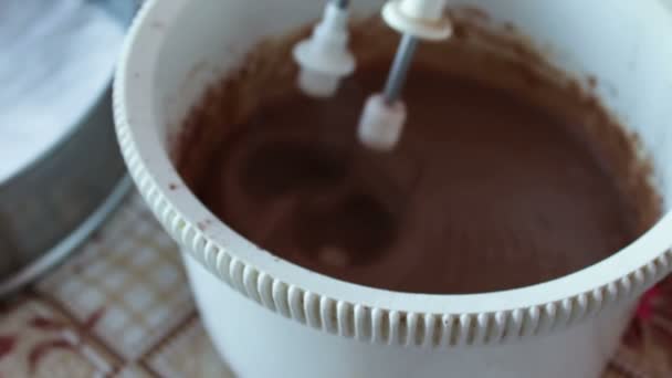 Baking a cake - mixing ingredients with an electric hand mixer — Stock Video