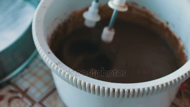 Baking a cake - mixing ingredients with an electric hand mixer — Stock Video