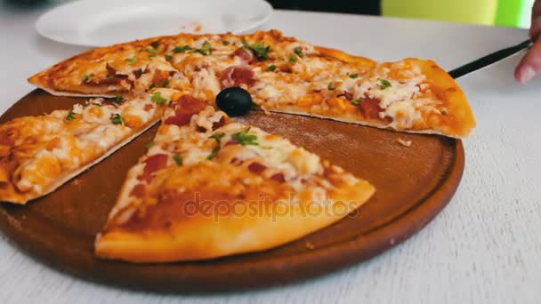 Delicious baked pizza with cheese, corn, tomatoes, meat and herbs in a stylish white background, Italian cuisine — Stock Video