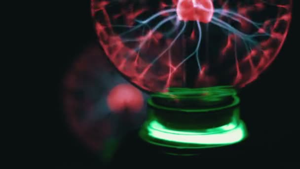 Closeup view of plasma ball with moving energy rays inside on black background — Stock Video