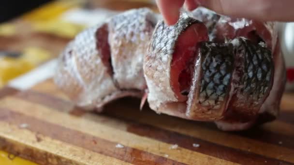 Frozen pieces of fish in home kitchen — Stock Footage Frozen pieces of fish in home kitchen Stock Footage