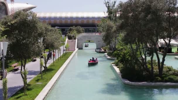 MAY 9, 2017 - AZERBAIJAN, BAKU: The so-called Baku Venice. People ride a gondola on the canal in a capital of Azerbaijan, Baku — Stock Video