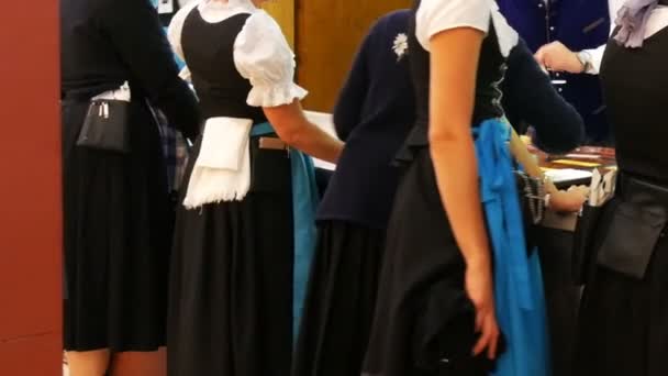 September 17, 2017 - Octoberfest,Munich, Germany:Waitresses in national Bavarian suits wait for food and beer in beer tent — Stock Video