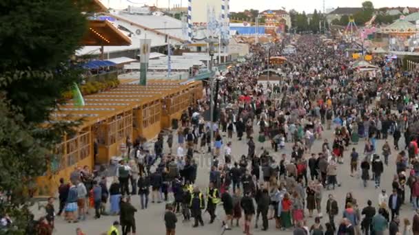 September 17, 2017 - Oktoberfest, Munich, Germany:View of the huge crowd of people walking around the Oktoberfest in national bavarian suits, on Theresienwiese, top view — Stock Video