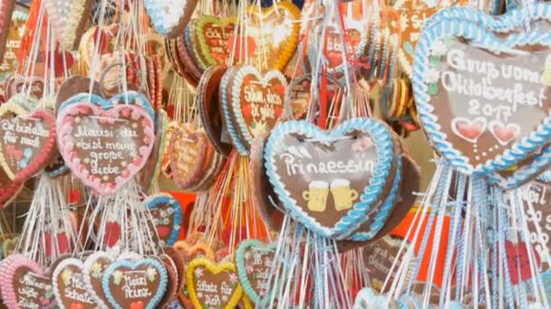 September 17, 2017 - Oktoberfest, Munich, Germany: Lot multicolored gingerbread decorations are hung on Theresienwiese in Bavaria, at a beer festival — Stock Video