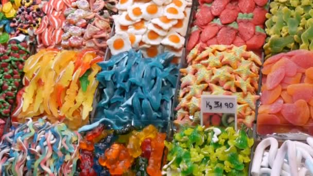 Large counter with various sweet candy in the food market in Spain.Sweet Candy Jelly Bonbon Lollipop Mixed of Snack Sugar — Stock Video