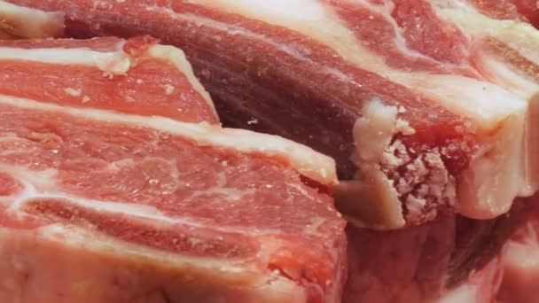 Fresh pink and delicious beef meat with white streaks macro close-up view — Stock Video