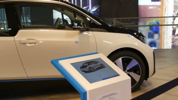 Munich, Germany - October 25, 2019: New electric car concept on exhibition hall in the BMW complex. New advanced cars stand at exhibition. New modern cars from the BMW Welt concern. — Stock Video
