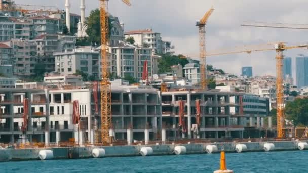 Istanbul, Turkey - June 11, 2019: June 11, 2019: Sea of Marmara. The view from the tourist ship that is sailing along the seashore to Bosphorus. Sailing past a large building site — 비디오