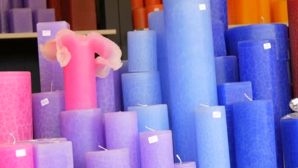 Many multi-colored large wax candles on counter of the Christmas market — 비디오