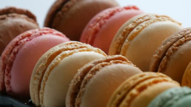 Multicolored macaron or macaroon on a white table — Stock Video
