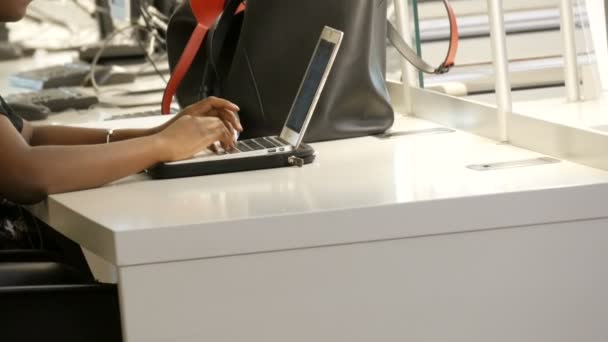 Amsterdam, Netherlands - April 24, 2019: Hands typing on a keyboard in a public library. Readers enjoying the calming environment of the Amsterdam Public Library, building with unique design — Stock Video