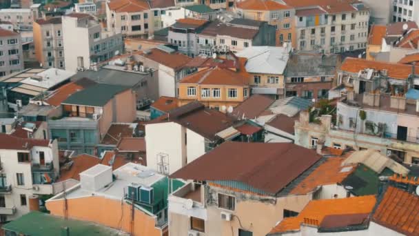 Beautiful red roofs with many satellite dishes and air conditioning. Crowded city Istanbul aerial view from Galata tower. Panoramic view with many house roofs — Stock Video