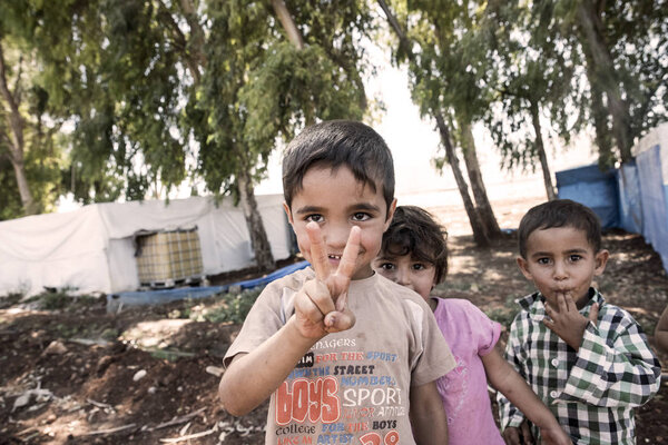 people in unofficial refugee camp