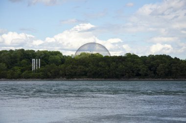 Montreal, Quebec, Canada - 17 July 2016: The Biosphere view from the river. The Biosphere is a museum in Montreal dedicated to the environment. Located at Parc Jean-Drapeau in the former pavilion of the United States as editorial