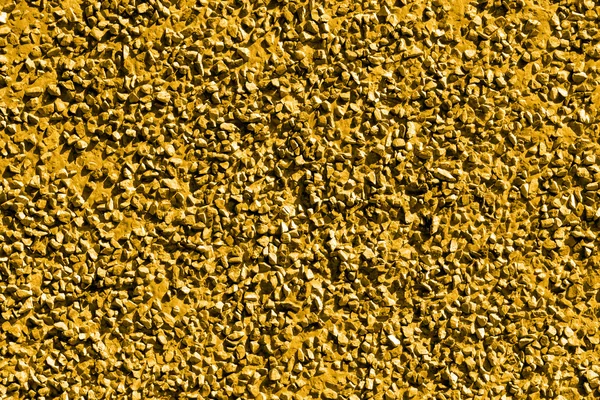 Złotych kamieni żwiru tekstura tło makro — Zdjęcie stockowe