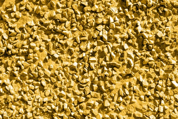 Pietre d'oro ghiaia texture macro sfondo — Foto Stock