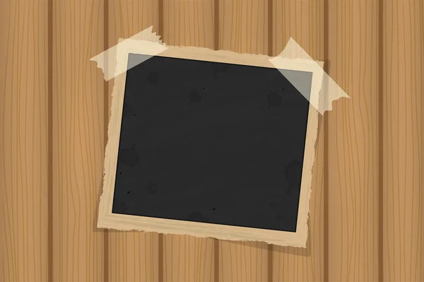 Square old vintage frame template on sticky tape with shadows on brown wooden texture — Stock Photo, Image