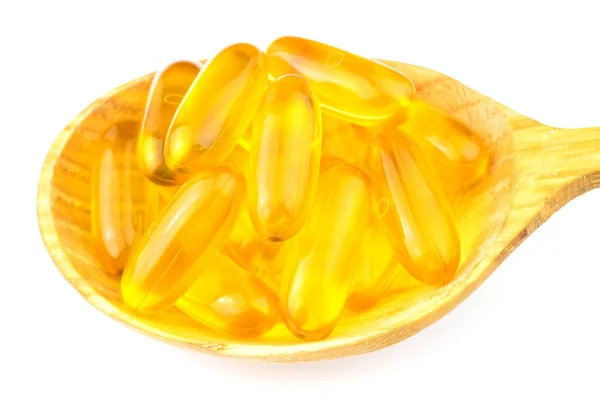 Pełna łyżka kwasów tłuszczowych, omega-3 kapsułki na białym tle. — Zdjęcie stockowe