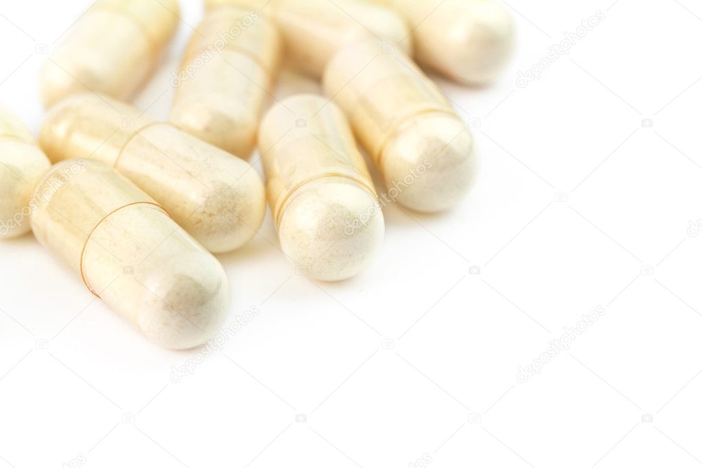 Food supplement pills, glucosamine capsules, isolated on white background, macro image