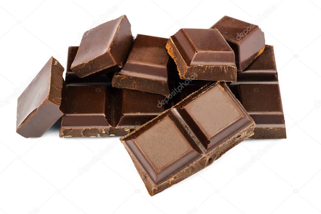 Dark chocolate cubes isolated on white background.