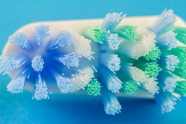 Macro photo of toothbrush isolated on blue background. — Stock Photo, Image
