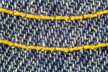 Mavi kot iç içe altın iplik, denim doku arka plan makro görüntü.