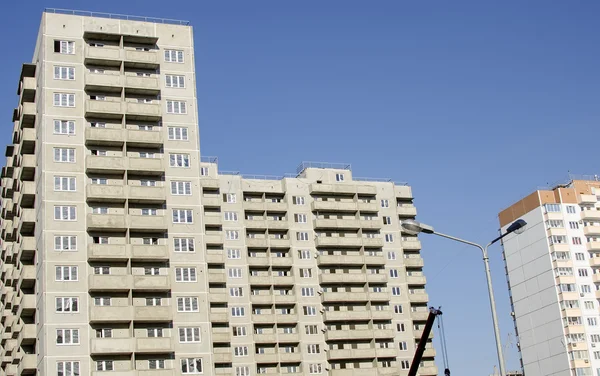 Monolithic concrete buildings against the sky. — Stock Photo, Image