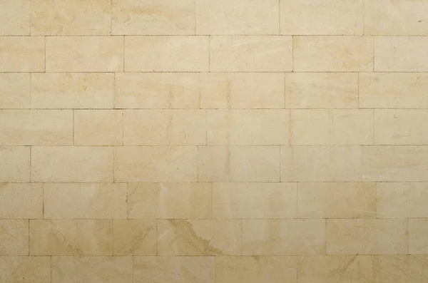 Arka plan gri-sarı gözenekli kumtaşı blokları