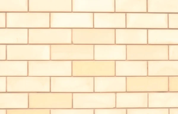 Close-up of a background of rectangles of pale yellow bricks. — Stock Photo, Image