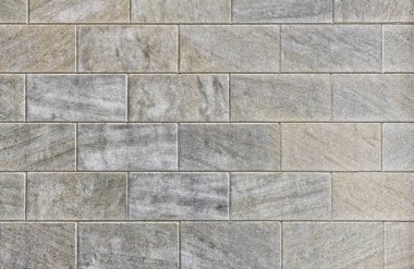 Yatay satırlarda katlanmış koyu gri renkli dikdörtgen bloklar.