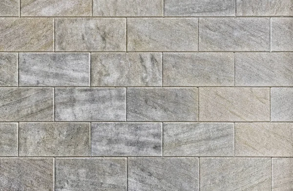 Yatay satırlarda katlanmış koyu gri renkli dikdörtgen bloklar.