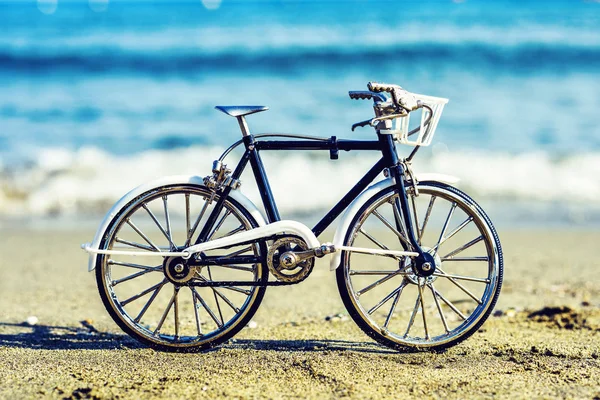 Daylight view to handicraft bicycle souvenir on sand — Stock Photo, Image