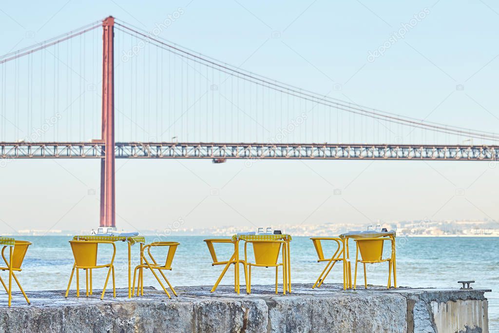 Shot of few tables for relax near the water in Lisbon Portugal
