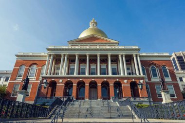 Red brick state house golden dome