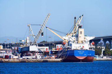 SAN DIEGO, CALIFORNIA - SEPTEMBER 30, 2019: Columbia River Hong Kong cargo ship and cranes in the port