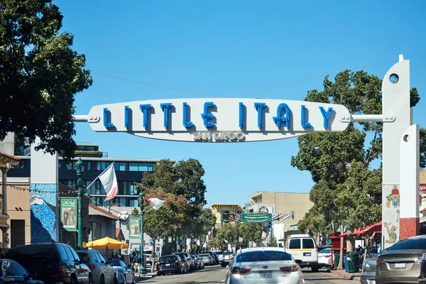SAN DIEGO, CALIFORNIA - SEPTEMBER 30, 2019: Little Italy neighborhood vintage style entrance sign. Cars riding on road