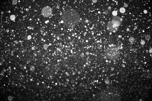 Snowfall isolado no fundo preto — Fotografia de Stock