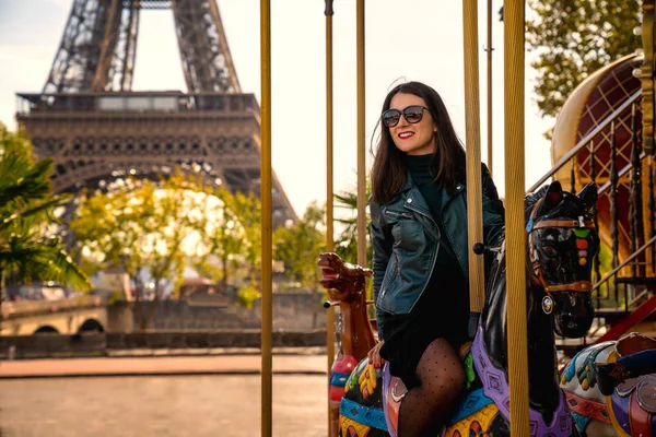 Girl riding on carousel in Paris — Stock Photo, Image