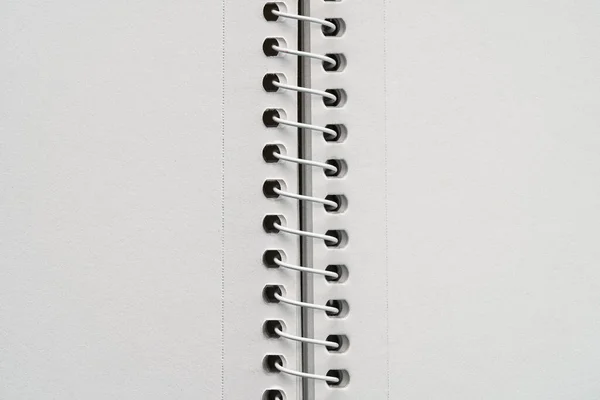 White blank notebook sheets with spiral in the center. Blank notebook.