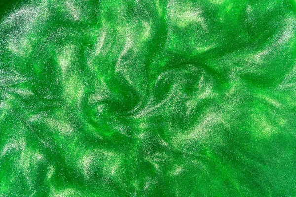 Abstract patterns with green paint. Green shiny backdrop.