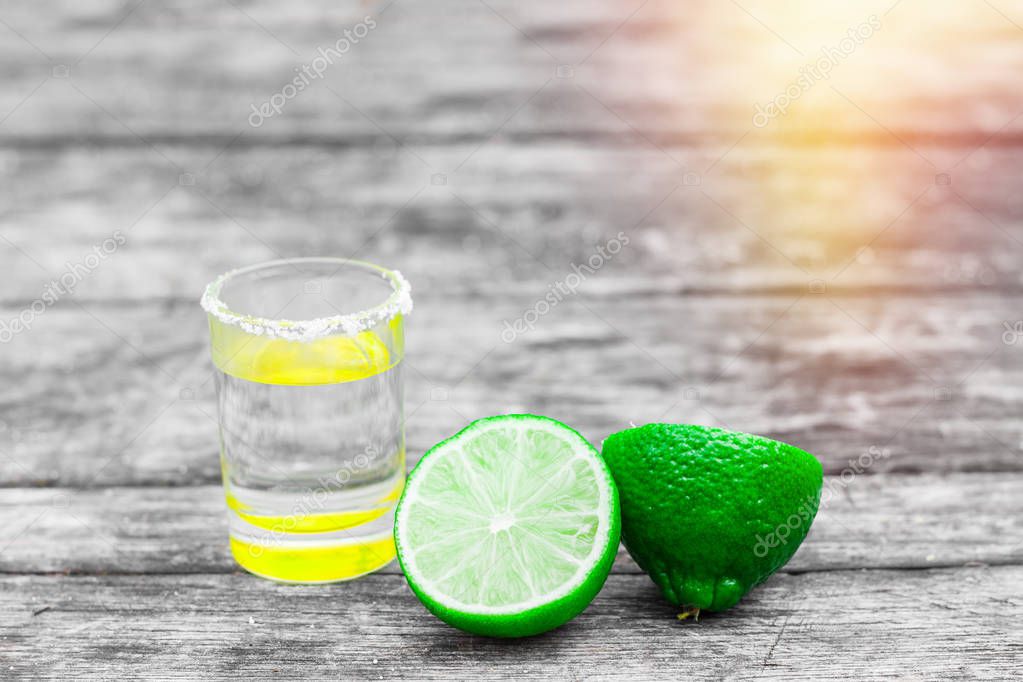 Shot Glasses With Golden Mexican Tequila Lime Slices And Salt Shot Glasses With Golden Mexican Tequila Lime Slices And Salt On Old Wooden Table