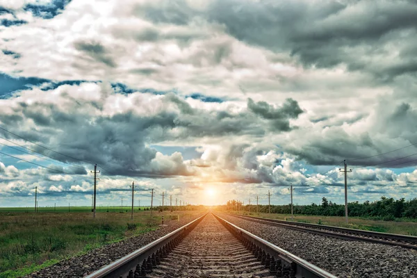 Railway at sunset with dramatic sky. Railroad track. Close up view. — Stock Photo, Image