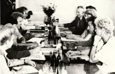 Vintage photo shows people during job meeting. Photography from communist era. Retro black & white  photography. clipart
